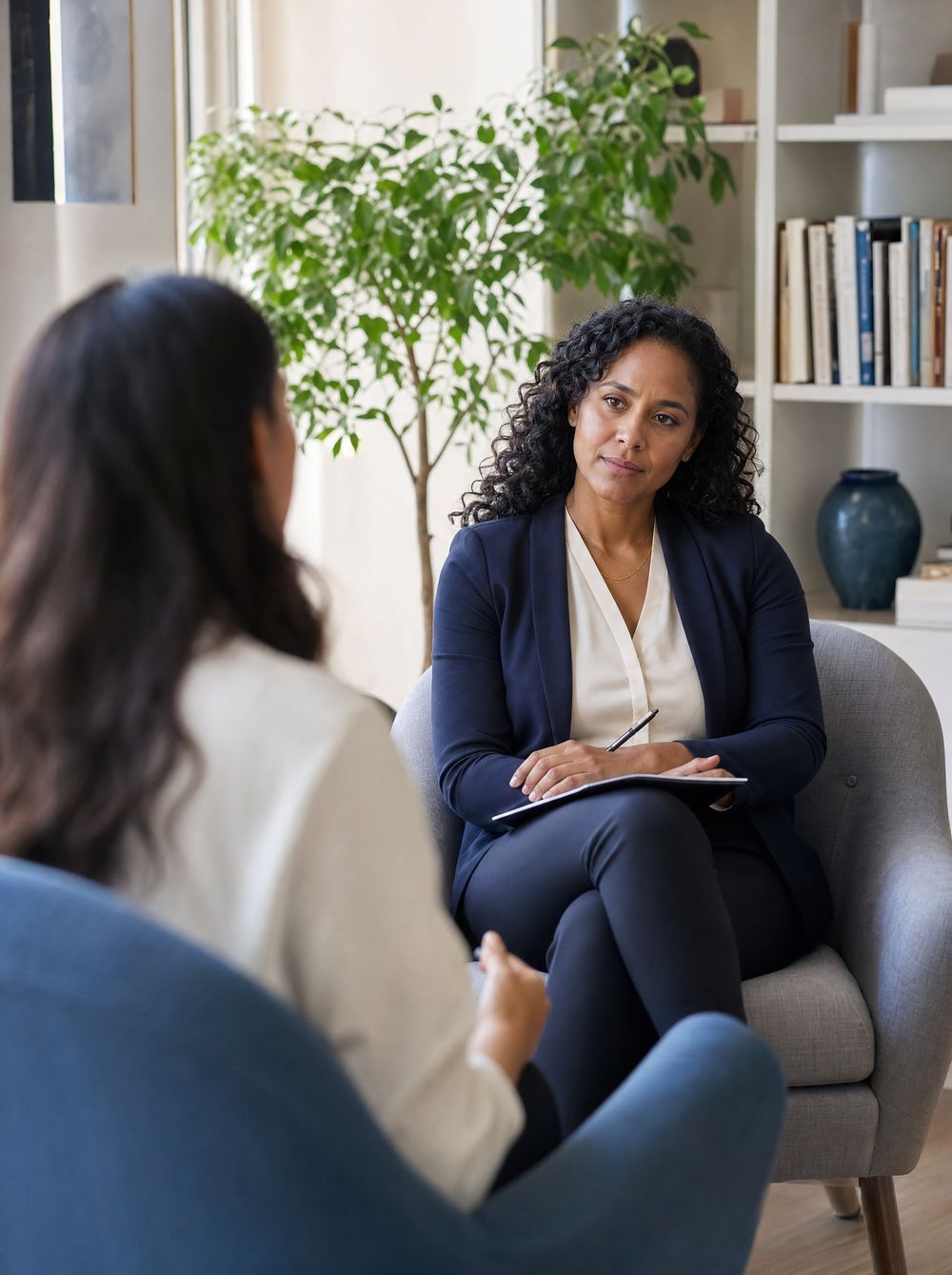 A psychiatrist listening to a patient in a calm office